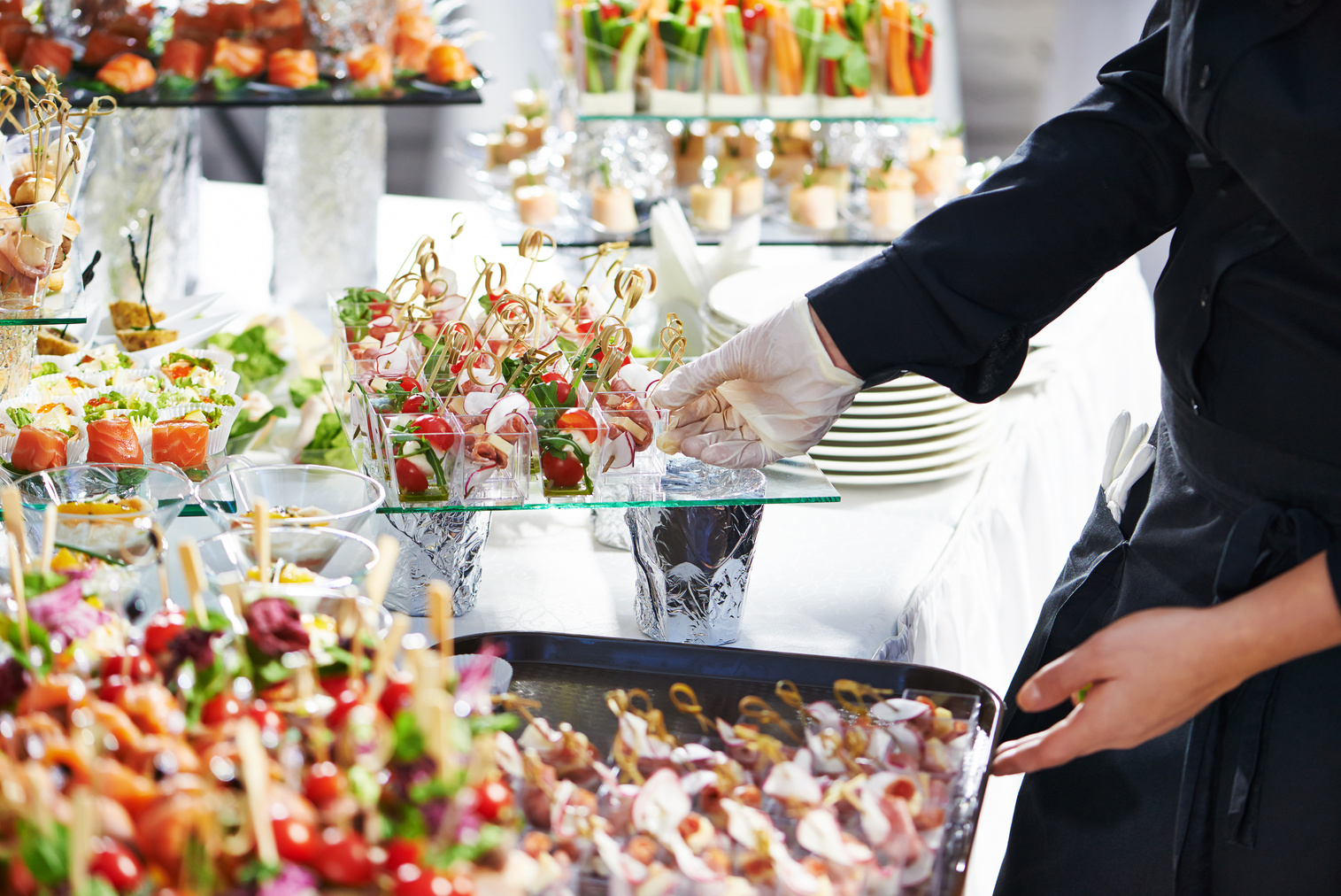 Waiter Serving Catering Table